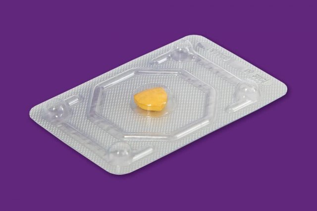 An ellaOne golden shield tablet in it's foil wrapper