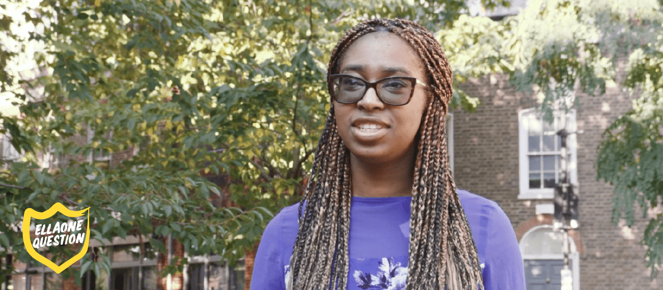 "ellaOne question" woman with glassed and braids on street