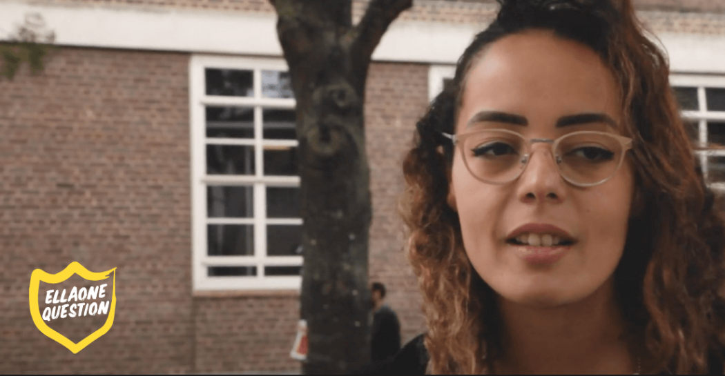 Photograph of a participant in the video. Text says 'ellaOne Question'.