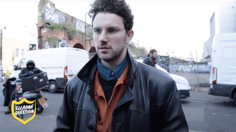 "ellaOne question" image of man with glasses on the street