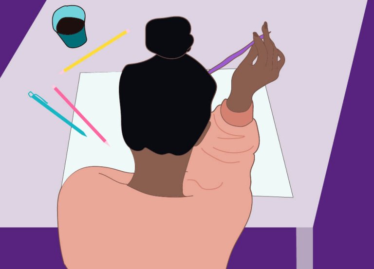 Woman sitting in front of white paper