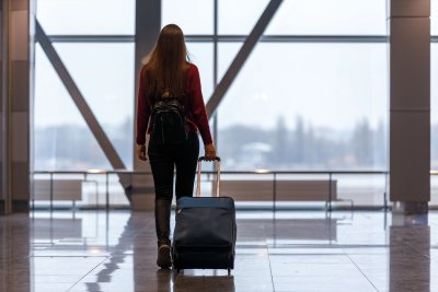 Woman travelling with her carry-on bag